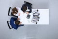 Business people at meeting, view from above. Bookkeeper or financial inspector making report, calculating or checki