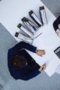 Business people at meeting, view from above. Bookkeeper or financial inspector making report, calculating or checking