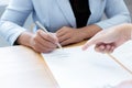 Business people negotiate for customers to sign land sales contracts Royalty Free Stock Photo