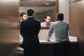 Business Man Brushing Teeth After Lunch Break In Office Bathroom Royalty Free Stock Photo