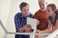 Business people, office building and tablet at staircase for meeting, collaboration or consulting with manager. Group of Royalty Free Stock Photo