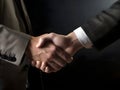 business people in office suits standing and shaking hands, close-up. successful, businessmen handshaking