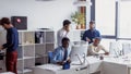 Business people in an open space office with a panoramic window, long shot Royalty Free Stock Photo