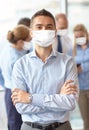 Businessman wearing face protective mask at office