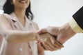 Business people partner shaking hand after business signing contract desk in meeting room