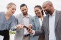 Business people, phone text and pointing outdoor to social media and networking app. Happy group, technology and Royalty Free Stock Photo