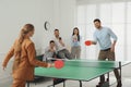 Business people playing ping pong in office Royalty Free Stock Photo