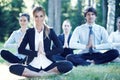 Business people practicing yoga