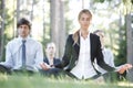 Business people practicing yoga Royalty Free Stock Photo