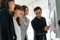 Business people proficiently discuss work project while sitting in circle Royalty Free Stock Photo