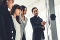 Business people proficiently discuss work project while sitting in circle Royalty Free Stock Photo