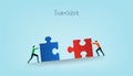 Business people puzzle pushing huge pieces of one puzzle towards each other. Symbol of working together, cooperation and Royalty Free Stock Photo