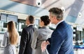 Business people queueing for check in at airport Royalty Free Stock Photo