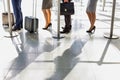 Business people queueing for check in at airport Royalty Free Stock Photo