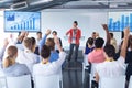 Business people raising their hands in a business conference Royalty Free Stock Photo