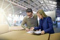 Business people, reading and checking inventory with storage for checklist in supply chain at warehouse. Coworkers or Royalty Free Stock Photo