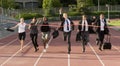 Business People Running Across the Finish Line Royalty Free Stock Photo