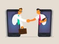 Business people shake hands through the phone screen. The concept of business communications Royalty Free Stock Photo