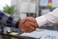 Business people shake hands to celebrate partnerships and business agreements. Effective communication and handshake concepts