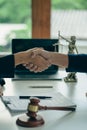 Business people shake hands to make an agreement male judge legal advisor A court litigation planning service contract after co-op Royalty Free Stock Photo