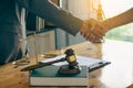 Business people shake hands to make an agreement male judge legal advisor A court litigation planning service contract after co-op Royalty Free Stock Photo