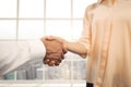 Business people shaking hands against city background Royalty Free Stock Photo