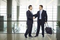 Business people shaking hands at airport Royalty Free Stock Photo