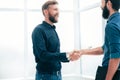 Business people shaking hands in a bright office Royalty Free Stock Photo