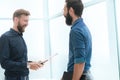 business people shaking hands in a bright office Royalty Free Stock Photo