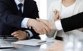 Business people shaking hands after contract signing in modern office. Teamwork, partnership and handshake concept Royalty Free Stock Photo