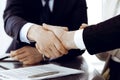 Business people shaking hands after contract signing in modern office. Teamwork, partnership and handshake concept Royalty Free Stock Photo