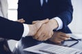 Business people shaking hands after contract signing in modern office. Teamwork, partnership and handshake concept Royalty Free Stock Photo