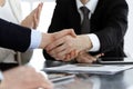 Business people shaking hands after contract signing in modern office. Teamwork, partnership and handshake concept Royalty Free Stock Photo