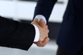 Business people shaking hands after contract signing in modern office. Unknown businessman, male entrepreneur with Royalty Free Stock Photo