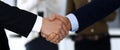 Business people shaking hands after contract signing in modern office. Unknown businessman, male entrepreneur with Royalty Free Stock Photo