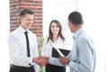 Business people shaking hands with each other in the office. Royalty Free Stock Photo