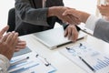 Business people shaking hands after finishing up a meeting. Businessman handshaking after conference. teamwork, partnership, coll Royalty Free Stock Photo