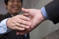 Business people shaking hands after finishing up a meeting. Businessman handshaking after conference. teamwork, partnership, coll Royalty Free Stock Photo