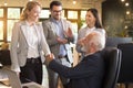 Business people shaking hands, finishing up a meeting in modern office workplace Royalty Free Stock Photo