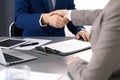 Business people shaking hands, finishing up a meeting. Papers signing, agreement and lawyer consulting concept Royalty Free Stock Photo