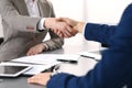 Business people shaking hands, finishing up a meeting. Papers signing, agreement and lawyer consulting concept Royalty Free Stock Photo