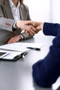 Business people shaking hands, finishing up a meeting. Papers signing, agreement and lawyer consulting concept Royalty Free Stock Photo