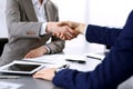 Business people shaking hands, finishing up a meeting. Papers signing, agreement and lawyer consulting concept Royalty Free Stock Photo