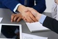 Business people shaking hands, finishing up a papers signing. Meeting, agreement and lawyer consulting concept Royalty Free Stock Photo