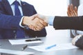 Business people shaking hands, finishing up a papers signing. Meeting, contract and lawyer consulting concept Royalty Free Stock Photo