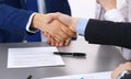 Business people shaking hands, finishing up a papers signing. Meeting, contract and lawyer consulting concept Royalty Free Stock Photo