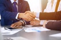 Business people shaking hands, finishing up a papers signing. Meeting, contract and lawyer consulting concept Royalty Free Stock Photo