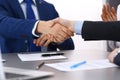 Business people shaking hands, finishing up a papers signing. Meeting, contract and lawyer consulting concept Royalty Free Stock Photo