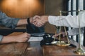 Business people shaking hands, finishing up a papers signing. Meeting, contract and lawyer consulting concept. Royalty Free Stock Photo