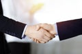 Business people shaking hands at meeting or negotiation, close-up. Group of unknown businessmen and a woman stand Royalty Free Stock Photo